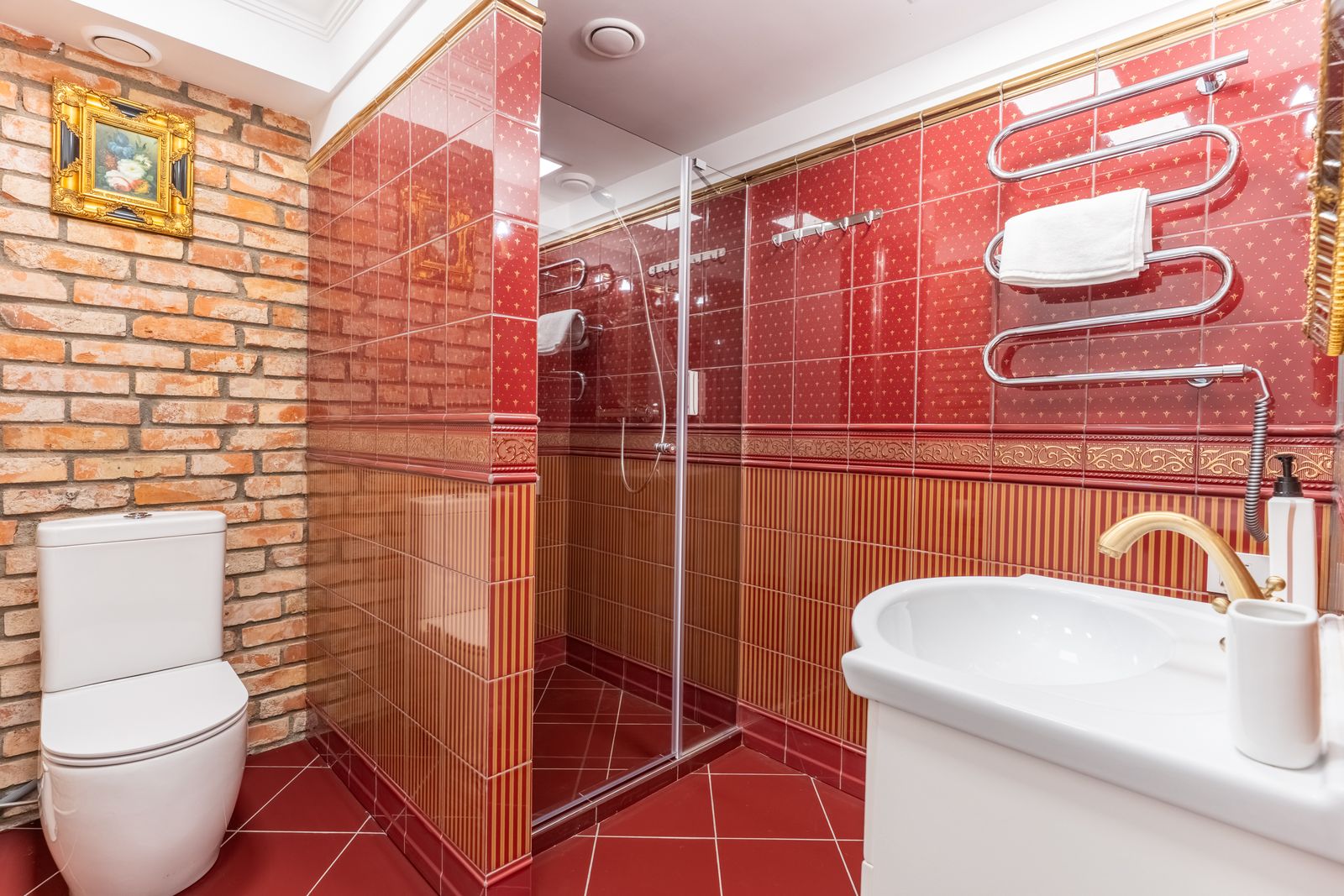 Private en-suite bathroom with a walk-in shower and brick walls — Underground Kingdom, Kaunas